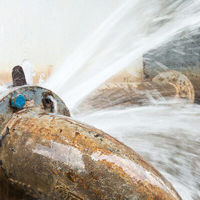 metal pipe with valve is leaking in water treatment plant