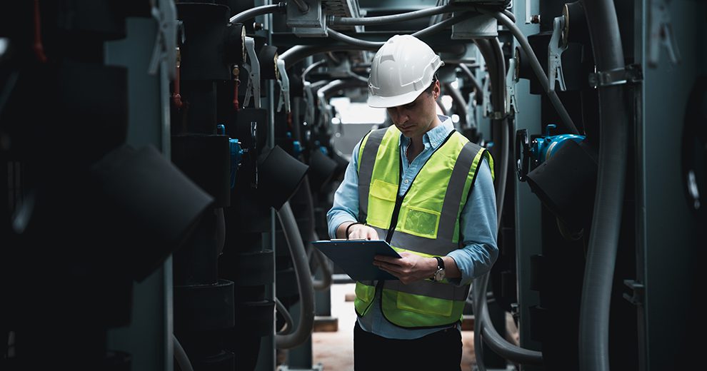 Engineers are inspecting a large building or industrial facility's cooling system for the air conditioning.