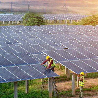 Engineering team inspecting or repairing solar cells on solar farms.