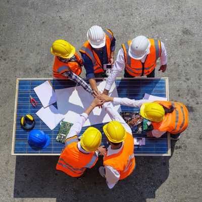 Top view of Architectural engineers putting their hands together