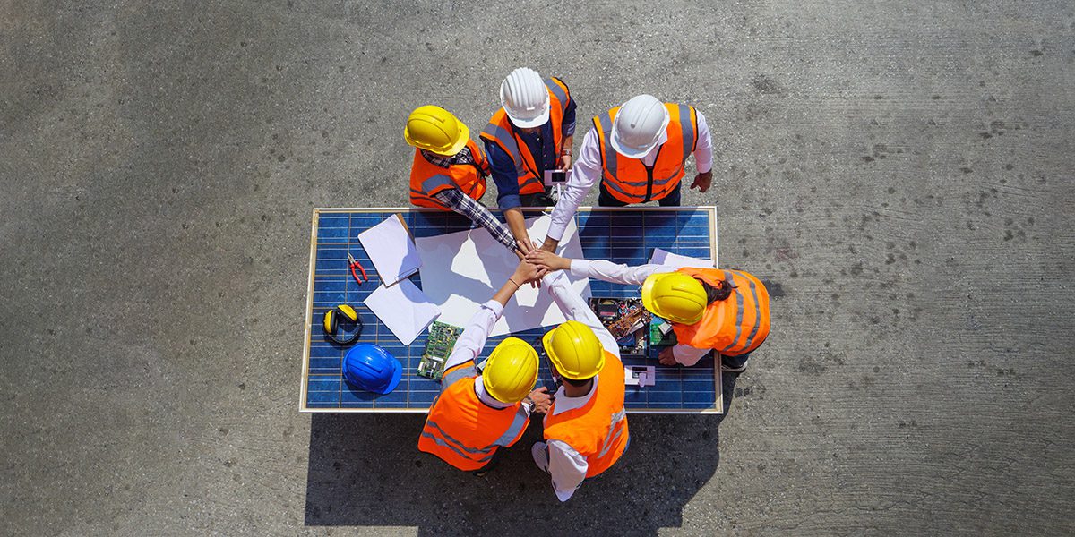 Top view of Architectural engineers putting their hands together