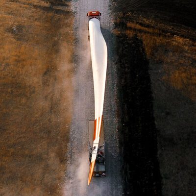 The turbine blades for a wind turbine being transported to the construction site