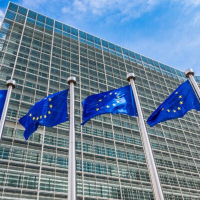 European flags in front of headquarters of European commission in Brussels in summer day